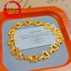 Gold-Plated Retro French Interlocking Heart Bracelet with Rice Grain Cut Design