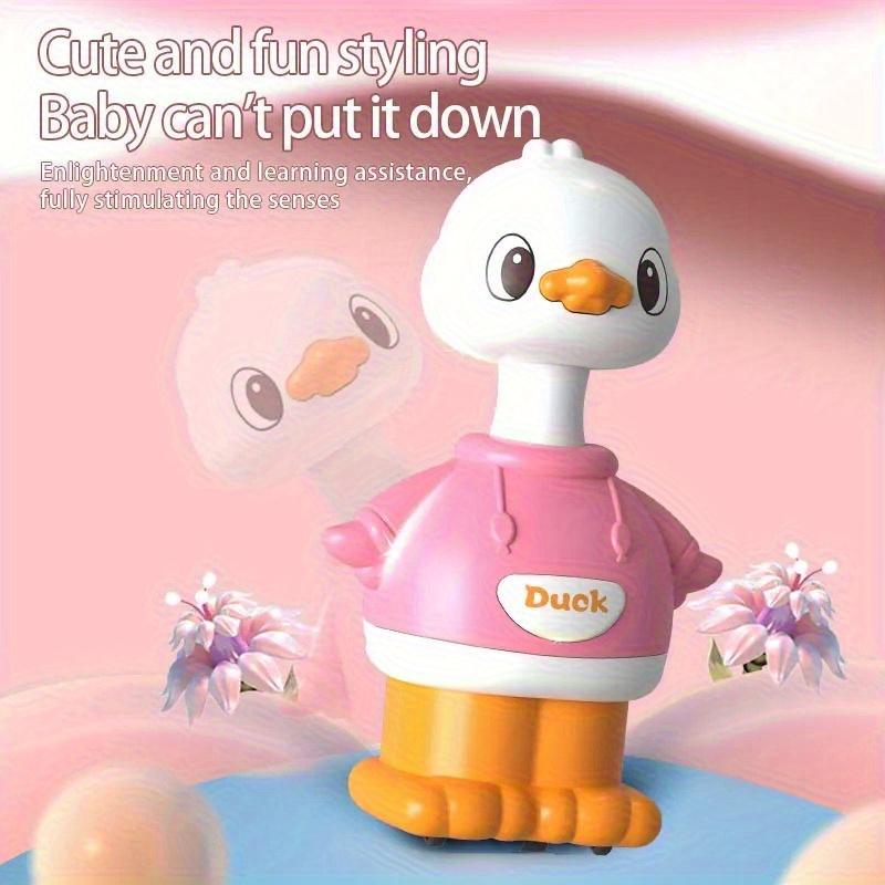 A Cartoon-shaped Sliding Toy, a Little Yellow Duck, That Bounces Back When the Youngsters Pushes It.