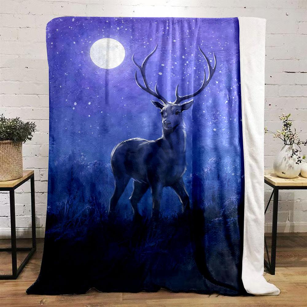 A stag stands in a moonlit, snowy, and serene nighttime setting. for all seasons blanket lunch break throw gift