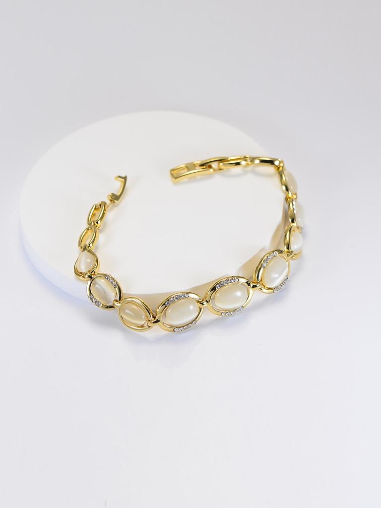 Женский браслет из розового золота 18 карат с камнем «кошачий глаз»