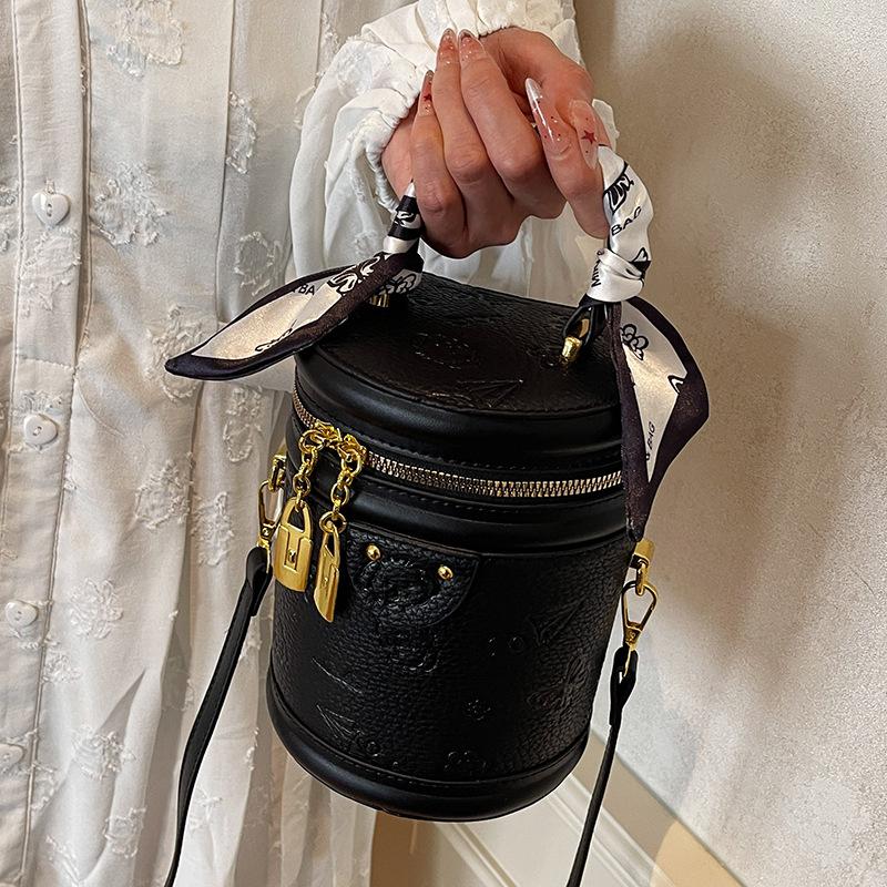 High-quality New Products Cute Embossed Light Luxury High-end Portable Cylinder Bag Niche Design Versatile Temperament Messenger Women's Bag