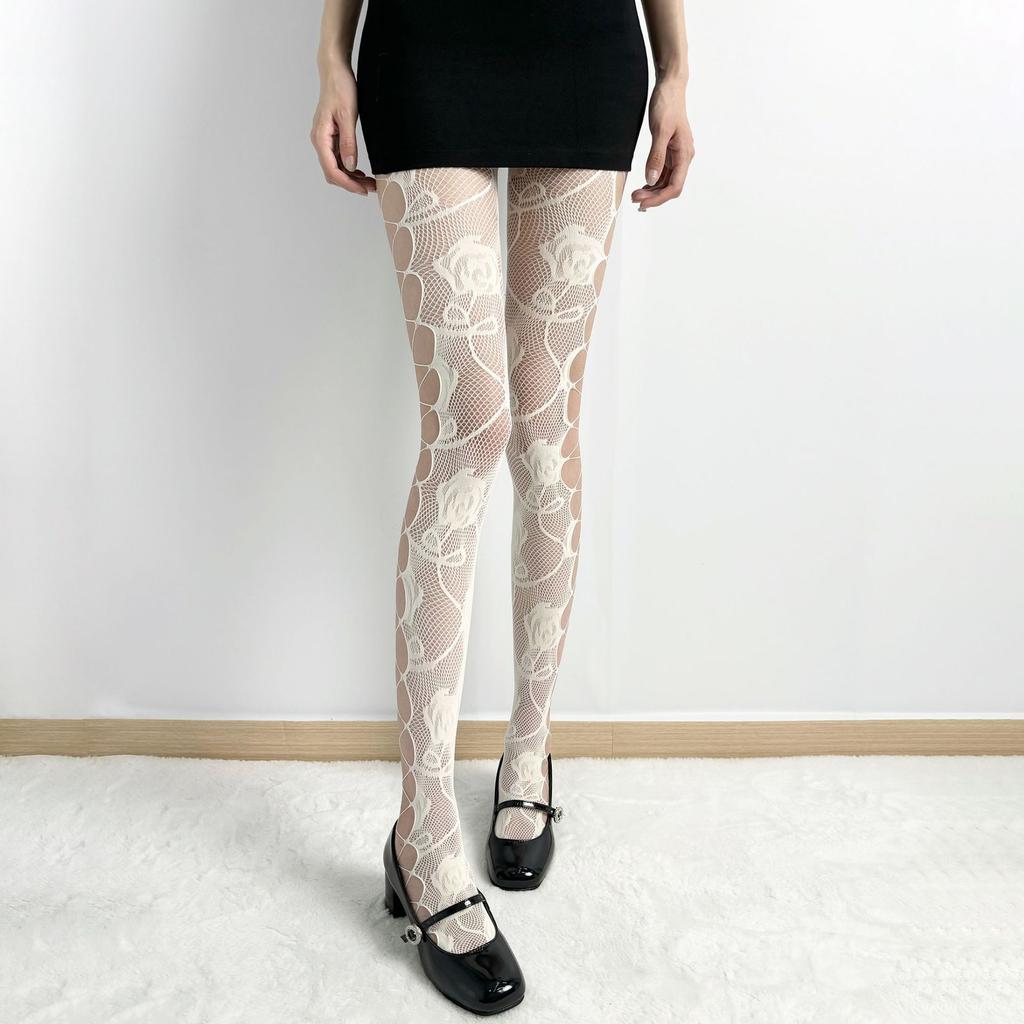 Millennial-style hot girl fishnet pantyhose with side cutouts, sexy and alluring, with integrated garter belt and rose jacquard design