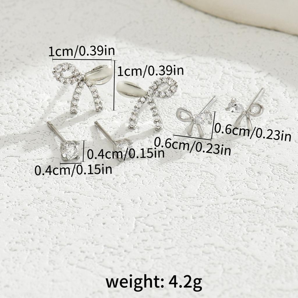 Простой небольшой свежий дизайн сережек-гвоздиков в виде банта, набор женских индивидуальных сережек с инкрустацией из циркония
