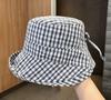 Spring and summer new plaid bow sunshade fisherman hat children outdoor big eaves show small face versatile sunscreen hat basin hat