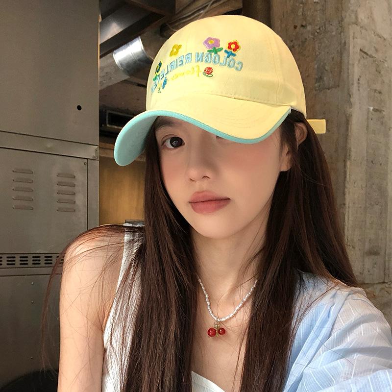 Sweet and cute flower embroidered baseball cap women's summer wide brim shows the face small peaked cap versatile casual soft top