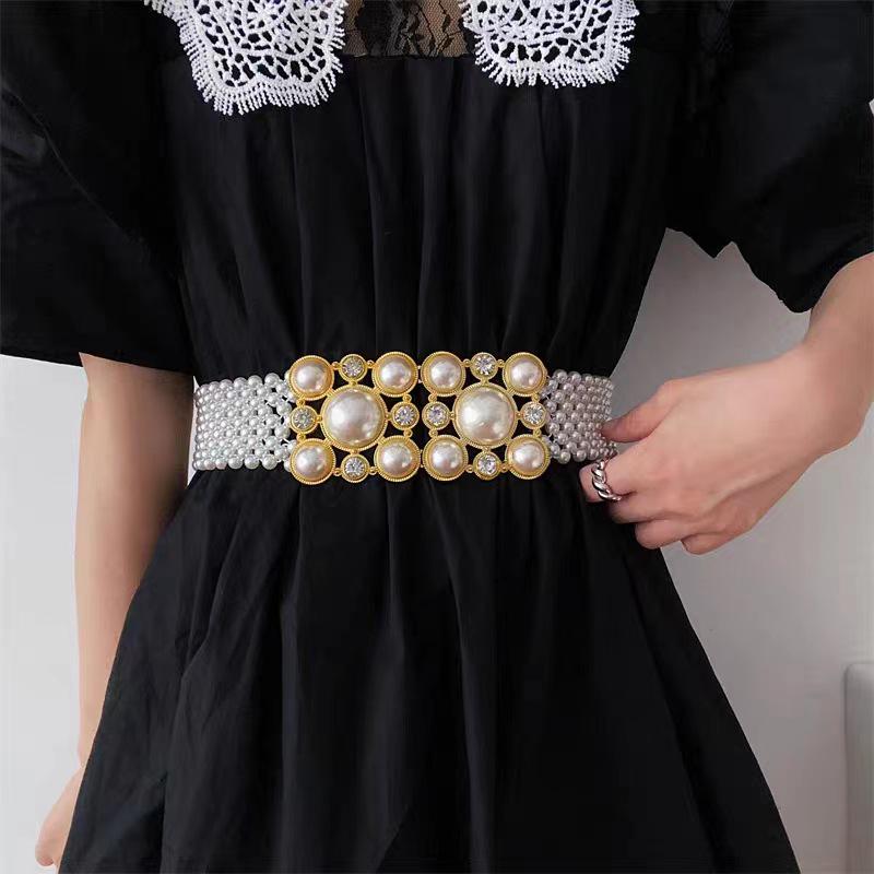 «Элегантный пояс со стразами и жемчугом: Универсальная широкая цепочка на талию для элитных пальто.