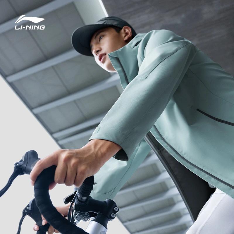 Спортивная куртка с капюшоном Li Ning Fitness Series однотонная светоотражающая мужская куртка серая AFDT843-3
