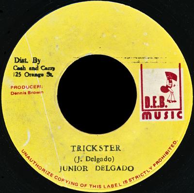7-дюймовая пластинка JUNIOR DELGADO - Trickster / Murder NONE D.E.B. Музыка 1978 Ямайка Регги, Ска и Даб Б/У