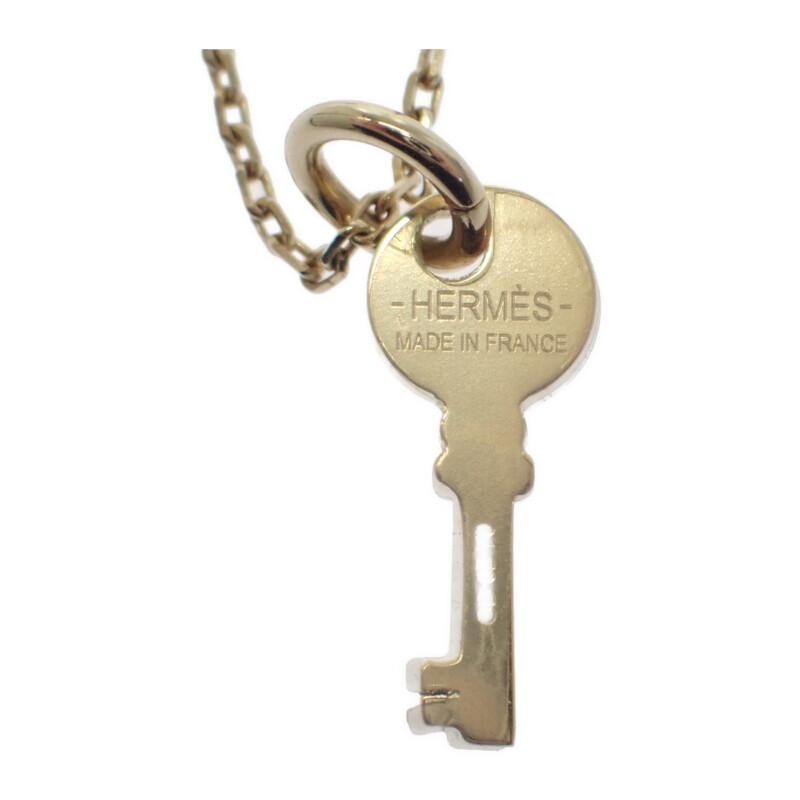 HERMES  H057027FD00  Ожерелье золото/черный металл/Буйволиный рог Женщины