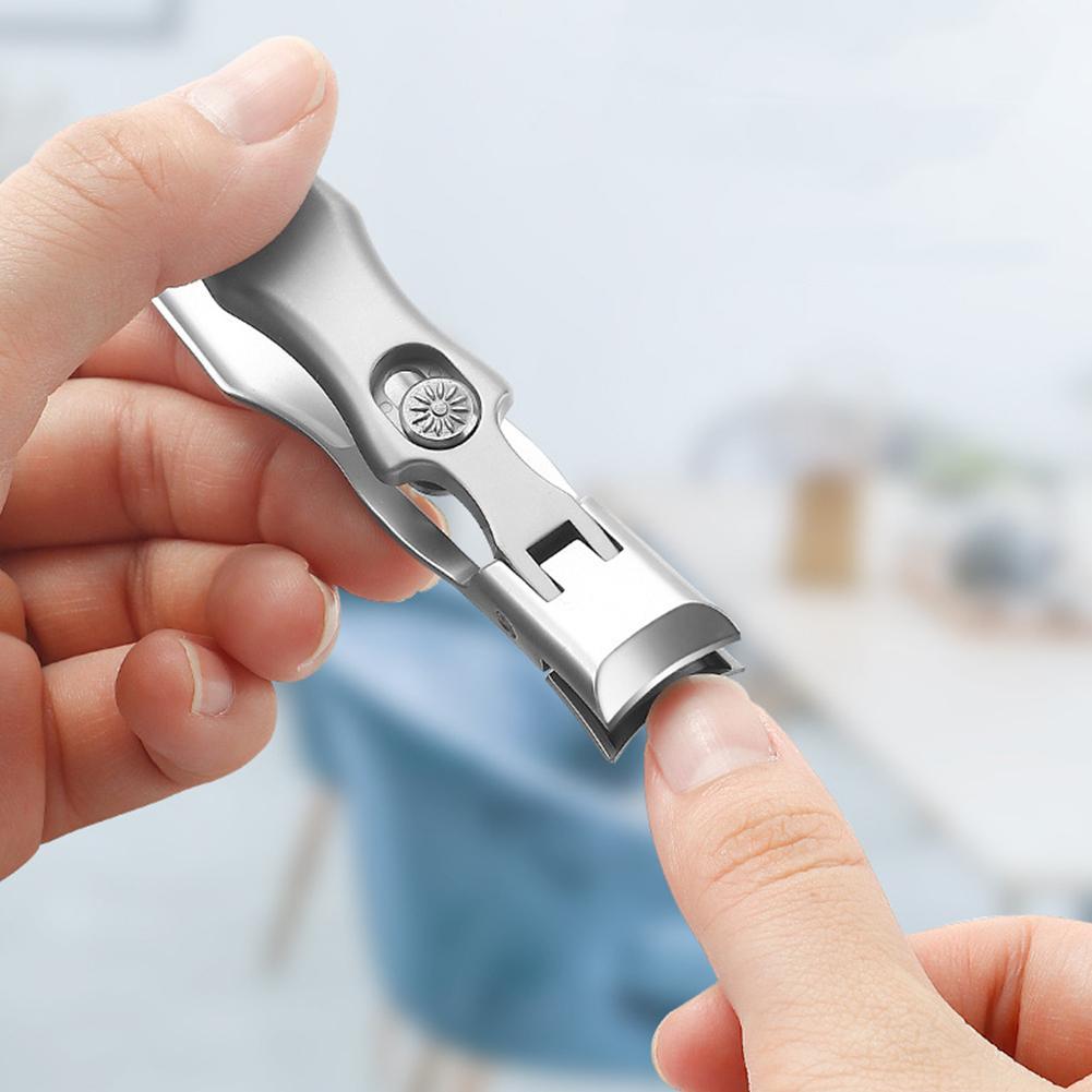 Self-locking folding nail clippers