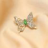 1pc Exquisite Style Gold Diamond Butterfly Brooch With Imitation Emerald Embellishment Showcasing Elegance Grace And Luxury
