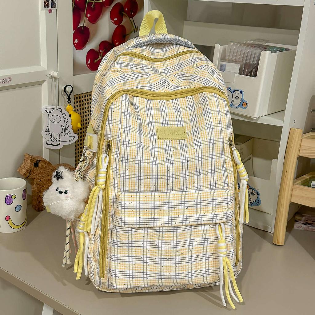Schoolbag Korean version retro plaid backpack large capacity spine protection to reduce the burden on primary school students, junior high school