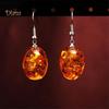 Овальные висячие серьги из искусственного янтаря