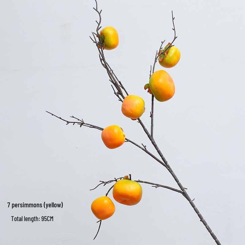 New Year Floral Arrangement with Golden Eucalyptus, Fan Leaf, Simulated Holly, Ginkgo, and Golden Leaf.