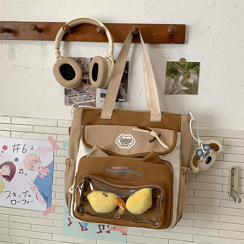 Школьный рюкзак 2025 новый ins милый высокоценный большой вместимости косметичка универсальный повседневный легкий милая сумка через плечо