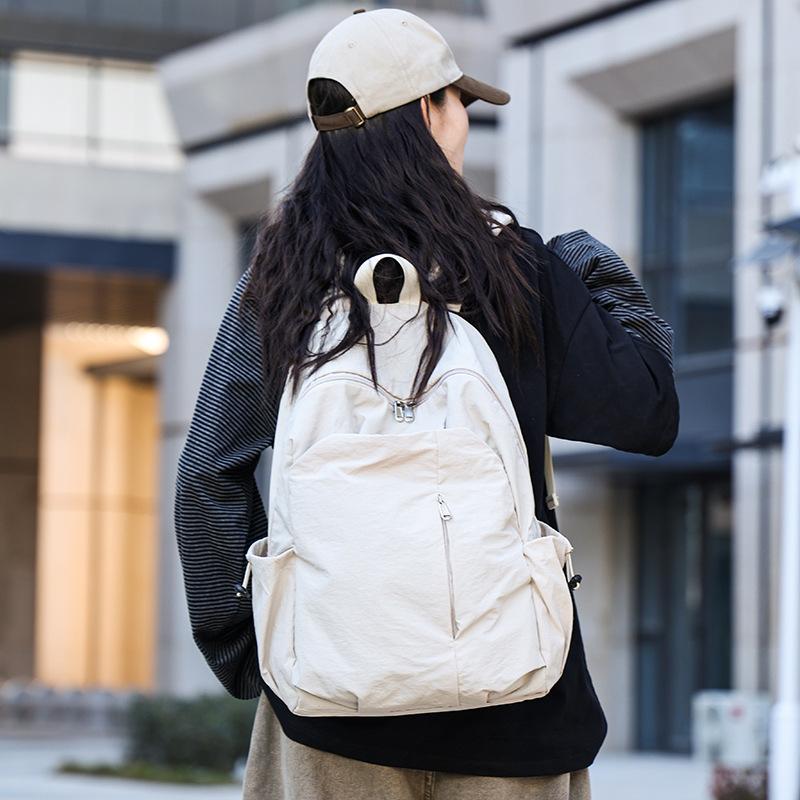 Schoolbag1011 New large-capacity backpack, male and female students schoolbag, multi-functional travel bag, casual and simple commuter bag