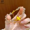 Shiny gold-plated peach champagne water drop bracelet with frosted heart-shaped lucky beads, exquisite and stylish, a gift for a girlfriend