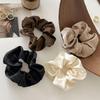 Satin-Feel Scrunchie: Versatile Luxury Hair Tie for Women, Elevates Style & Compliments Skin Tone.