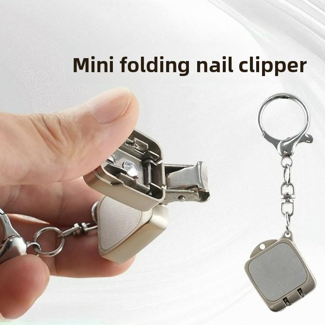 Stainless steel folding mini nail clippers, flip keychain decorative charm, mini small portable nail clippers