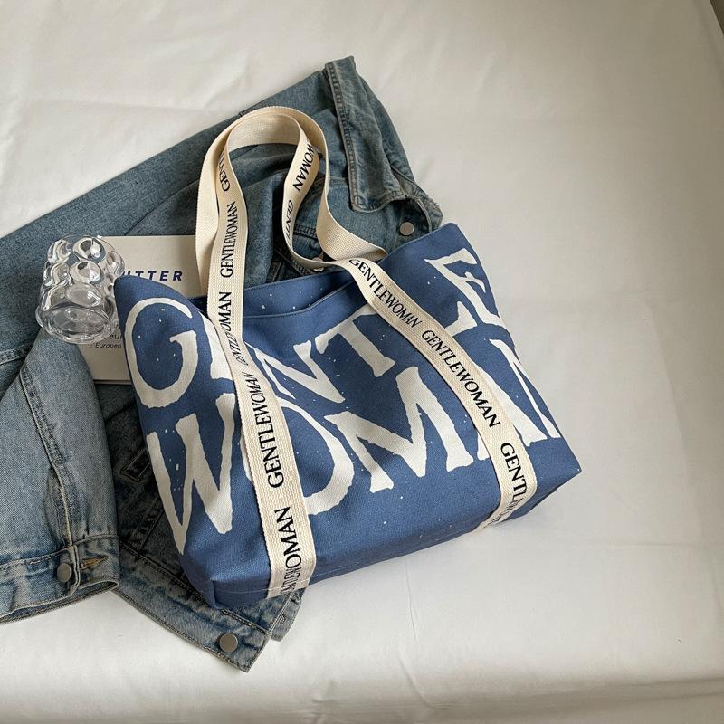 2025 Модная холщовая сумка Ленивый ветер Японская Большая вместимость Студенческая холщовая сумка Ремешок с алфавитом Сумка-тоут