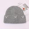 Small pearl knot knitted hat Korean version casual versatile face small winter warm hat