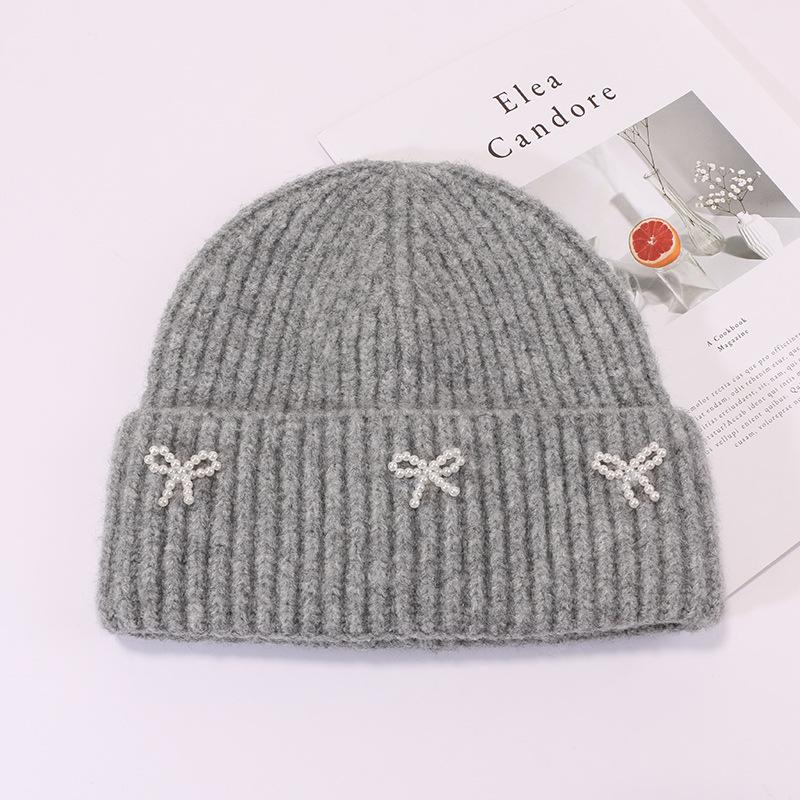 Small pearl knot knitted hat Korean version casual versatile face small winter warm hat