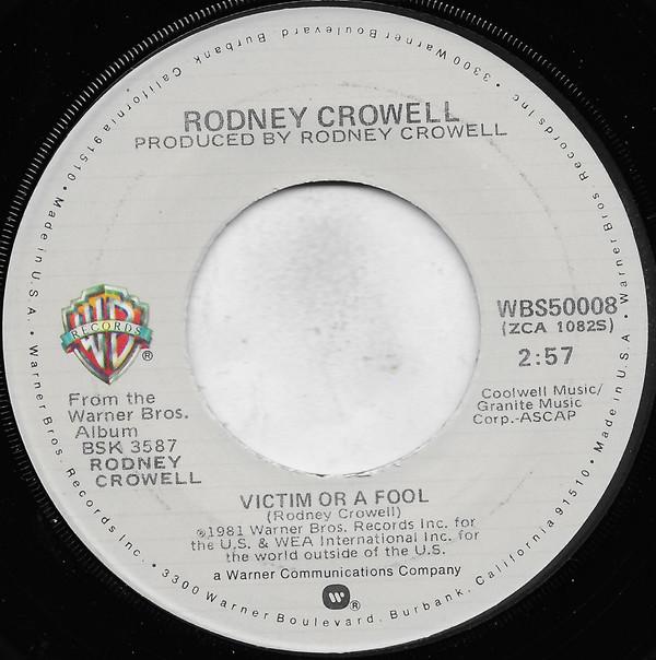 Пластинка 7 дюймов RODNEY CROWELL - Victim Or A Fool / Only Two Hearts WBS50008 Warner Bros. Переиздание 1981 г. США Фолк Б/У