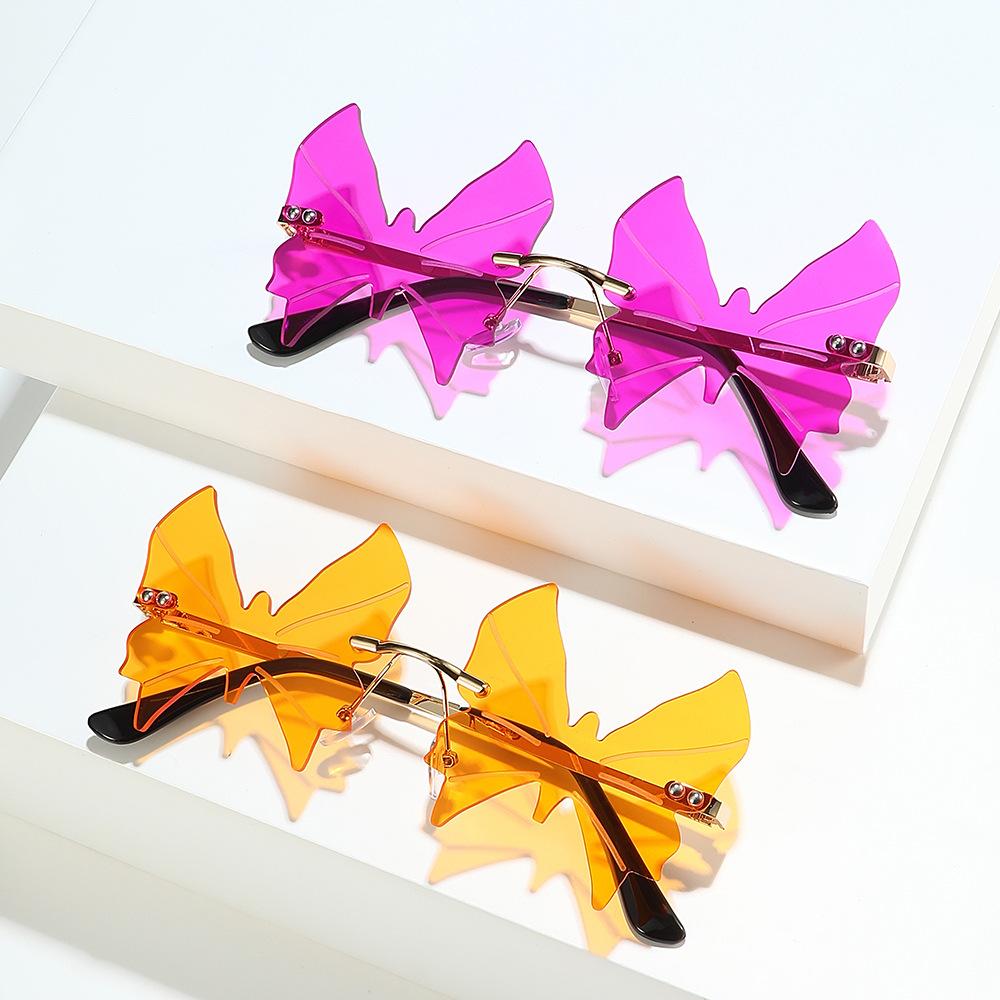 Frameless sunglasses, European and American personalized women's fashion butterfly irregular hip hop ins sunglasses