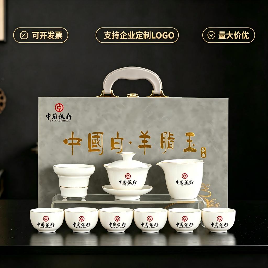 Dehua suet jade porcelain tea set is a complete set of gold-painted white porcelain household tea making utensils Company