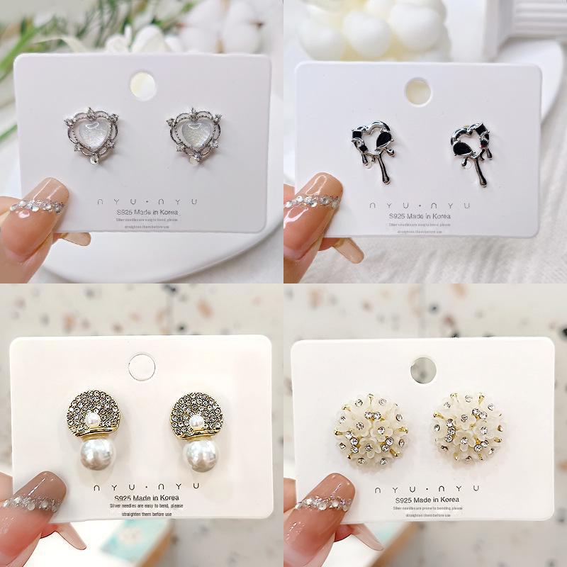 «Серьги-бантики из серебряных игл с жемчугом и цирконием»: Нишевый дизайн, стильный и универсальный, легкий роскошный аксессуар высокого класса.