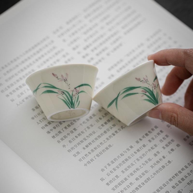 Hand painted orchid ceramic teacup white porcelain master cup tea tasting cup tea kung fu teacup underglaze color small Spring Festival gift
