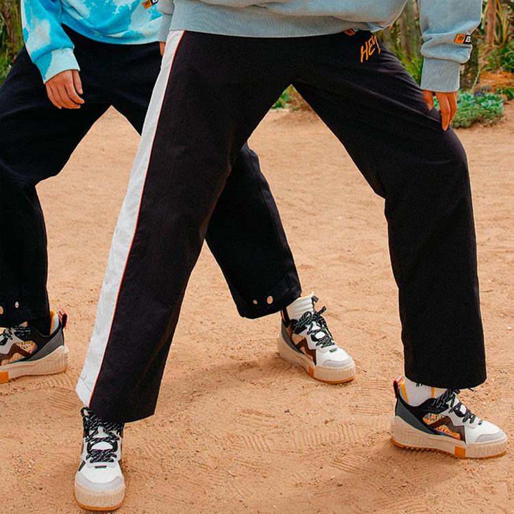 Li Ning X Universal Pictures Sports Fashion Series Боковые цветные кнопки длинные брюки унисекс брюки черные AYKR811-2
