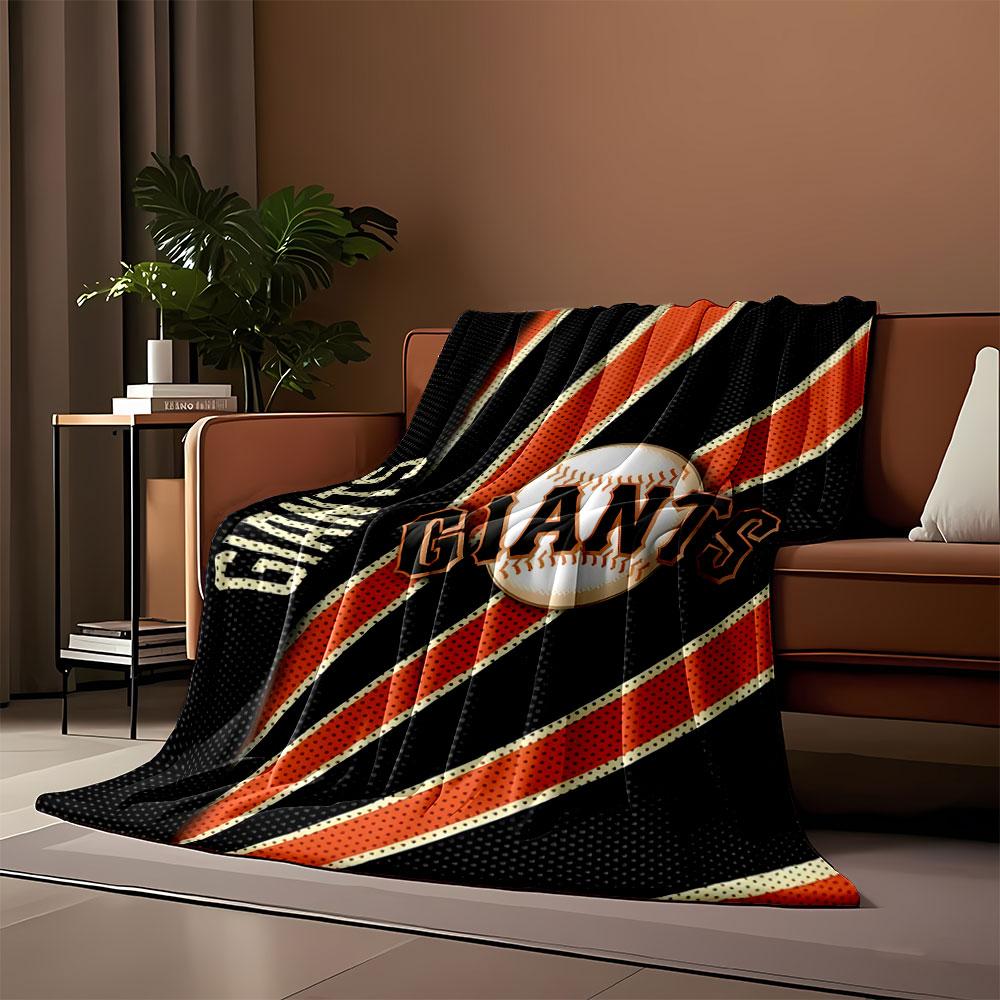 A baseball design with "GIANTS" text and orange rays on a black background. for all seasons blanket lunch break throw gift