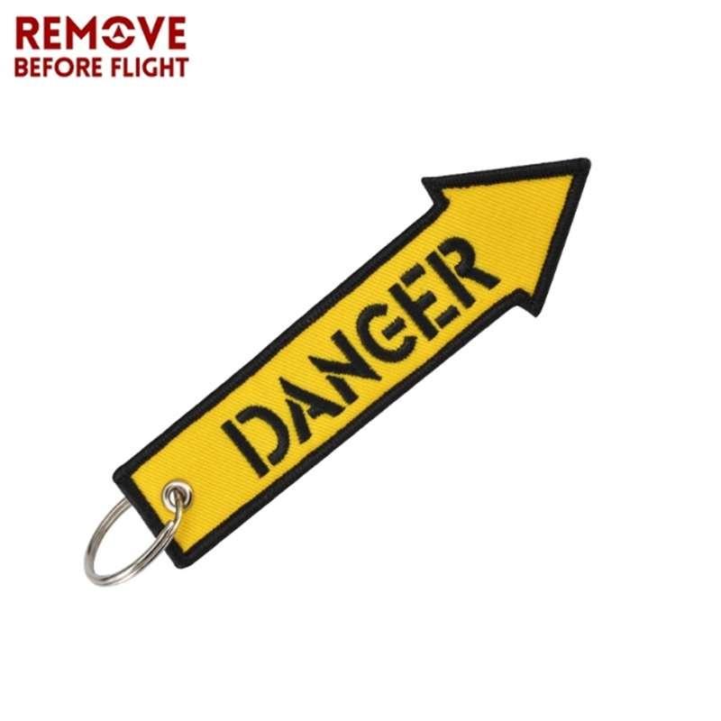 Удалите перед полетом желтый брелок с вышивкой в ​​виде буквы опасности, ремешок для ключей, брелок