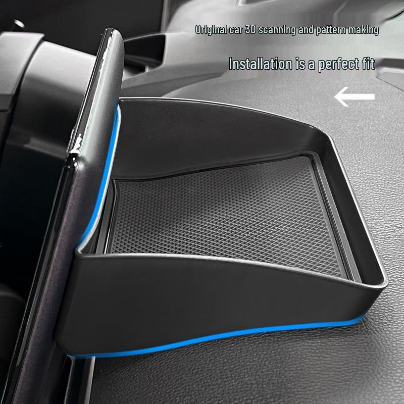 Toyota BZ3 Dashboard Organizer: Center Console, Screen, Rear Storage, and Tissue Holder.