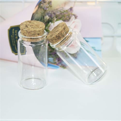 12 50ml clear glass bottles suitable for storing candy flavoring powders and liquids.