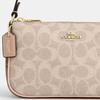 Маленькая сумка на плечо Coach Nolita 19 из канвы с signature-принтом