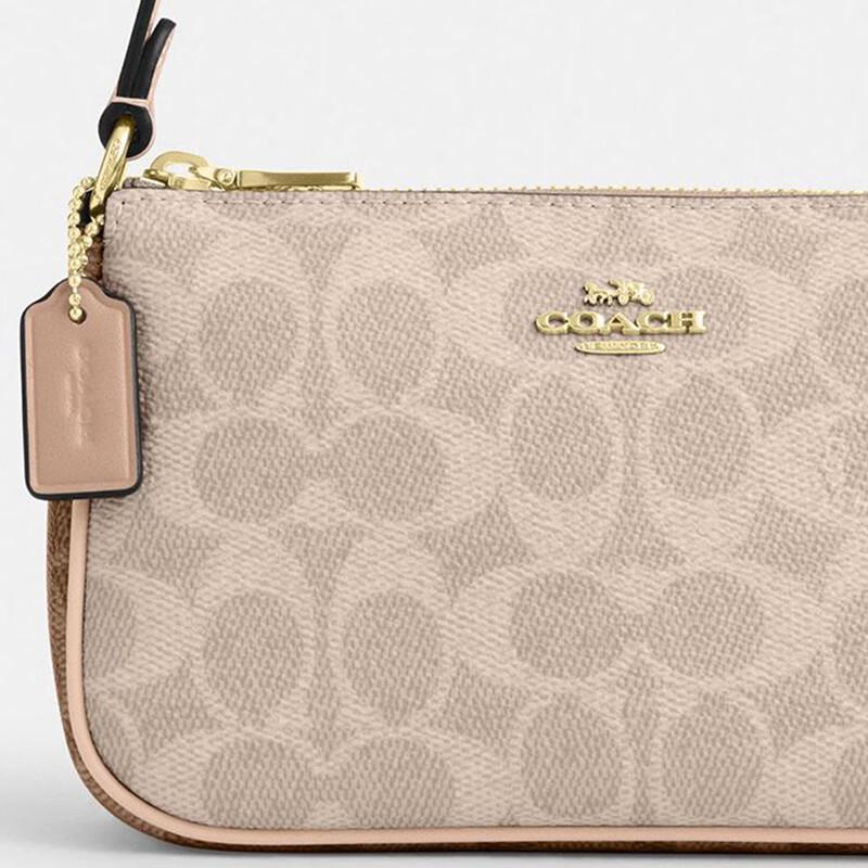 Маленькая сумка на плечо Coach Nolita 19 из канвы с signature-принтом