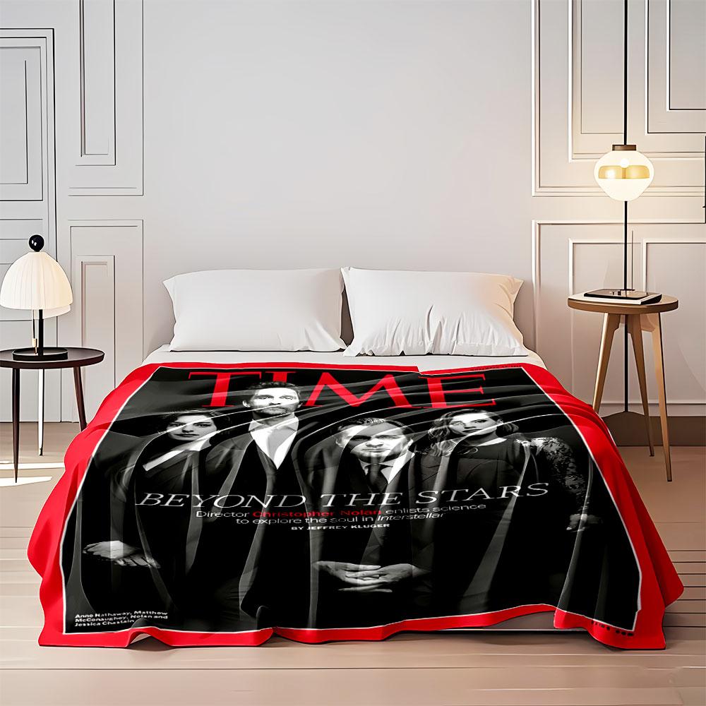 Black-clad group poses formally, surrounded by red border and text. for all seasons blanket lunch break throw gift