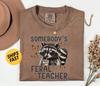 Comfort Colors® Somebodys Feral Teacher Shirt, Funny Raccoon Teacher Graphic Tee, Cute Butterfly Print, Trendy Teacher Life Shirt