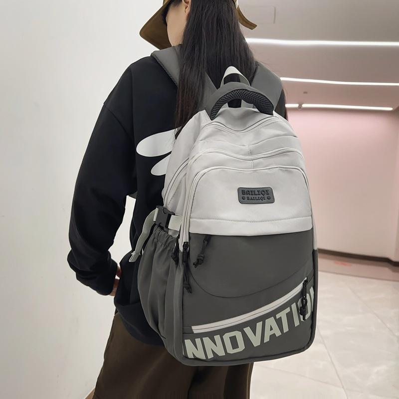 Schoolbag air cushion pallet backpack high-end junior high school students leisure travel couple college students thick wear-resistant dirt-resistant