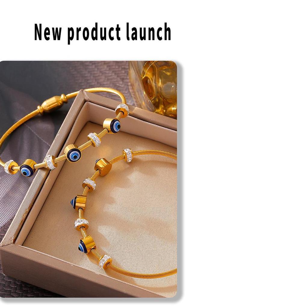 Браслет из титановой стали с 18-каратным золотом и бриллиантами от «дурного глаза»