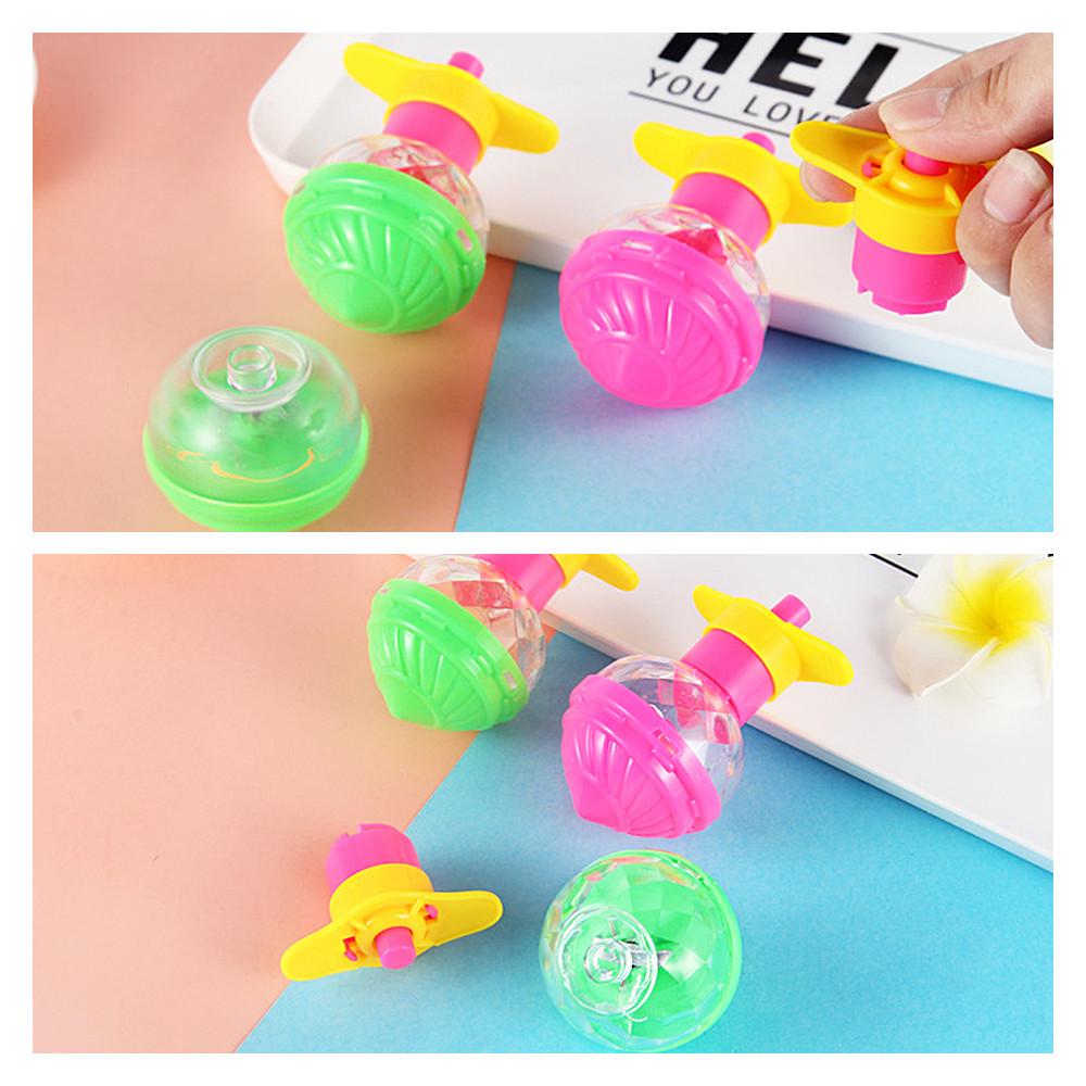 Классические детские мигающие вращающиеся волчки освещают ослепительные гироскопические игрушки