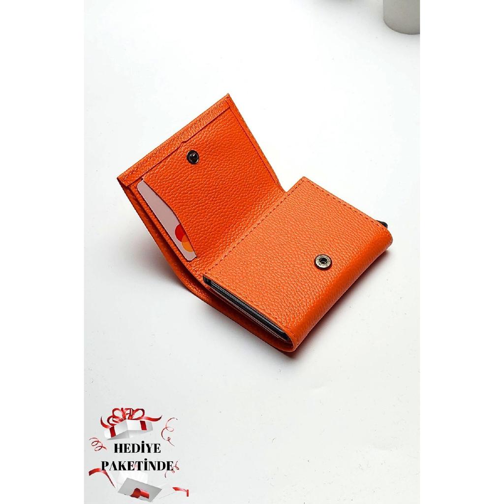 Оранжевый кошелек из веганской кожи унисекс с отделением для денег и держателем для карт с автоматическим механизмом. Подарочный пакет для портфолио?