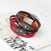 Qi Nuo Multi-Layer Leather Bracelet with Buckle and Feather Charm