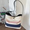 Нишевая дорогая маленькая сумка, женская, 2025 новая, полосатая парусиновая сумка, модная на плечо, кроссбоди, сумка-ведро
