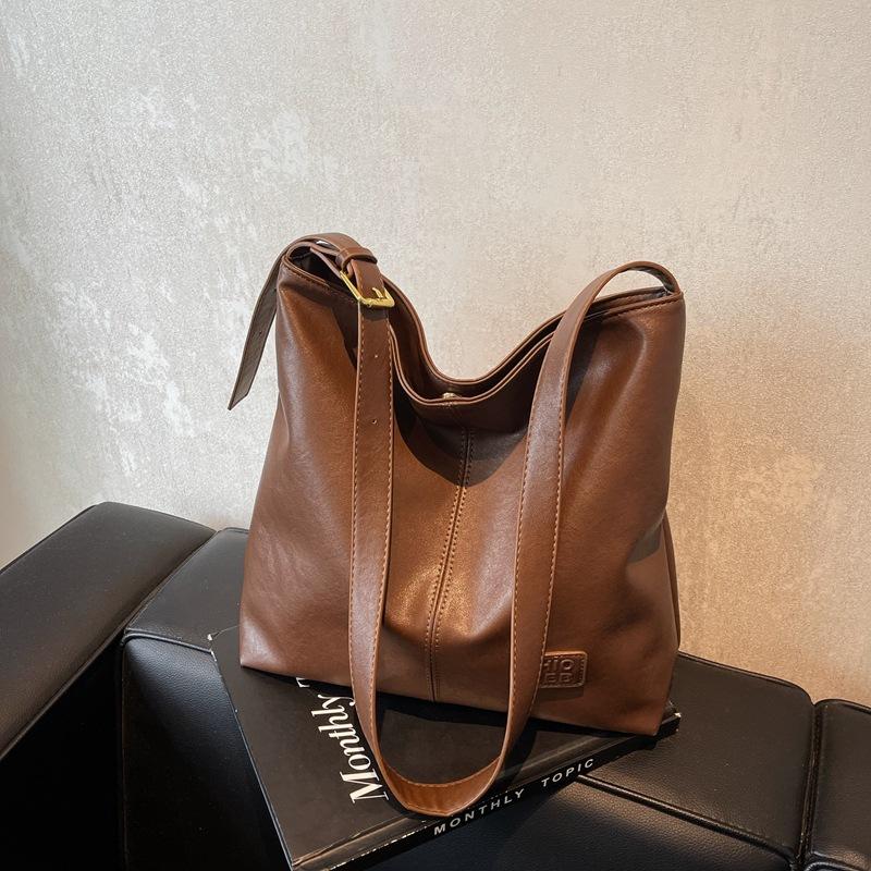 Премиальный стиль Новая осенне-зимняя сумка-ведро большой вместимости Премиальный стиль Нишевая наплечная сумка-подмышка Сумка-тоут