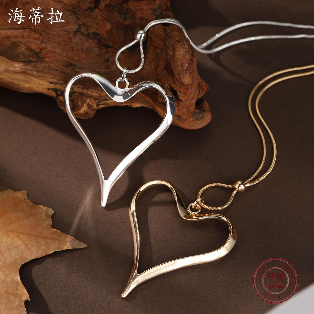 Новое полое преувеличенное ожерелье с длинной подвеской в виде любви, женский полый универсальный длинный кулон в форме сердца