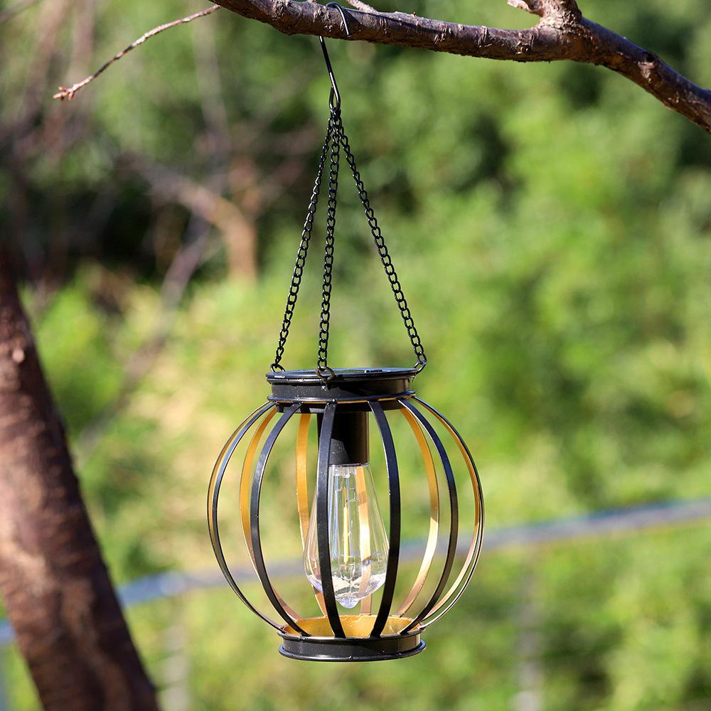 Solar Wrought Iron Lantern Light: Retro Mesh Pendant for Outdoor Garden, Courtyard, and Balcony Ambiance.