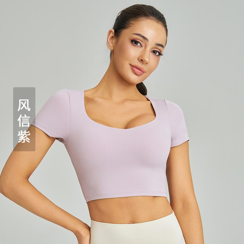 Weiman nude skin-friendly yoga short-sleeved chest pad mesh stitching cross-strap running sports quick-drying top women